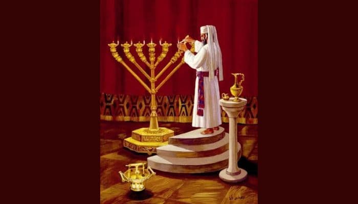 Aaron the priest lighting the menorah